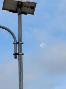 Solar Panel on Pole with Moon in Sky 写真素材