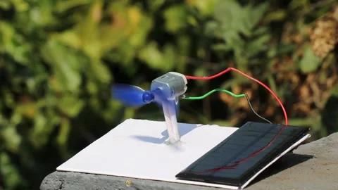 Solar panel is powering the dc motor with its shaft connected to propeller Stock Footage 327978618