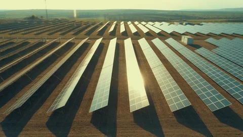 Solar panel produces green, environmentaly friendly energy from the setting sun Stockbeeldmateriaal 105525055