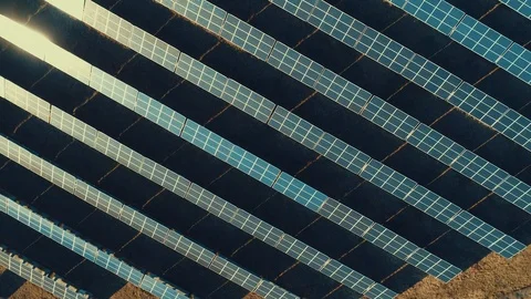 Solar panel produces green, environmentaly friendly energy from the setting sun Stock Footage 123484199
