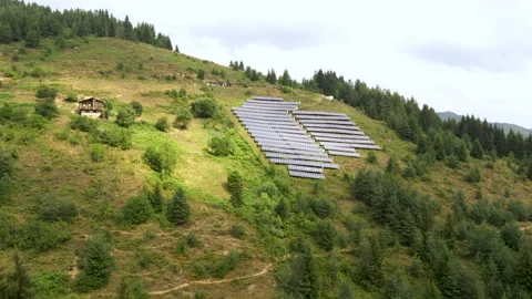Solar panel produces green, environmentaly friendly energy from the setting sun Stock Footage 158564111