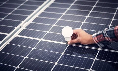Solar panel, renewable energy lightbulb and man hands test quality of 스톡 사진