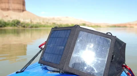 Solar panel on river with cliff Video stock 56902478