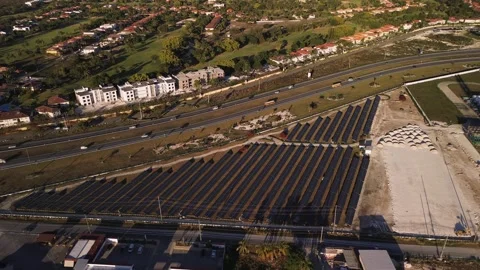 Solar panel rows and highway aerial view. Photovoltaic panels farm. Dominican Vídeo Stock 268756964