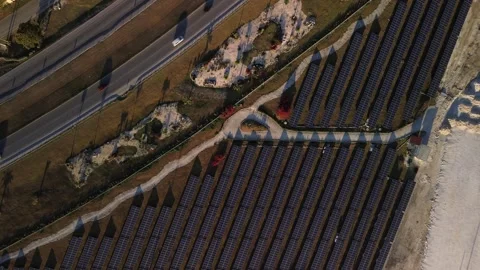 Solar panel rows and highway aerial view. Photovoltaic panels farm. Dominican Stock Footage 269383209