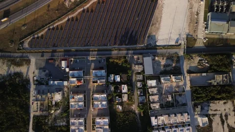 Solar panel rows and highway aerial view. Photovoltaic panels farm. Dominican Stock Footage 274224863