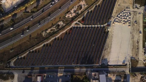 Solar panel rows and highway aerial view. Photovoltaic panels farm. Dominican Stock Footage 274224926