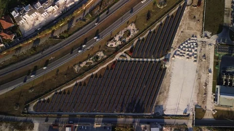 Solar panel rows and highway aerial view. Photovoltaic panels farm. Dominican Stock Footage 274485329