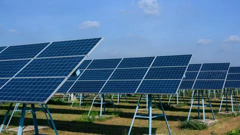 Solar panel station, Engineer installing solar panel at solar energy farm field Stock Photos