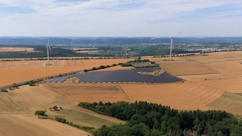 Solar panel station, wind turbine park, agriculture field with windmills Video stock 342221819