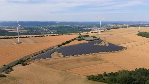 Solar panel station, wind turbine park, agriculture field with windmills Stock Footage 345270380