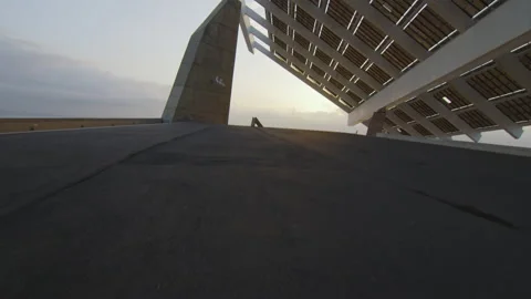 Solar panel structure and modern architecture at sunrise by the sea Stock Footage 221125699