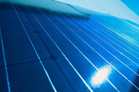 Solar panel with sunlight and blue sky background. Alternative energy ecolo.. Stock Photos