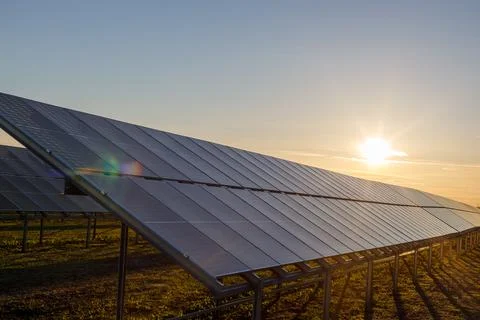 Solar panel with sunlight, sunset. Concept of clean energy, alternative sourc Stock-Fotos