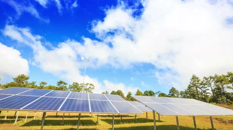 Solar panel Supplying Electricity with White Clouds and Blue Sky Stock Footage 52367997