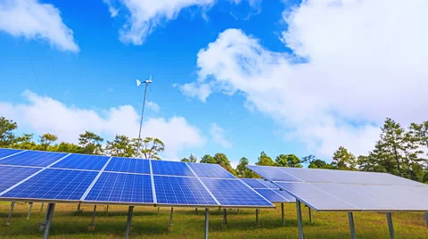 Solar panel Supplying Electricity with White Clouds and Blue Sky Stock Footage 52368230