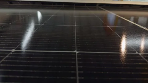Solar Panel Surface Reflects Interior Light, Showing Clean Renewable Energy Tech Stock Footage 346157094