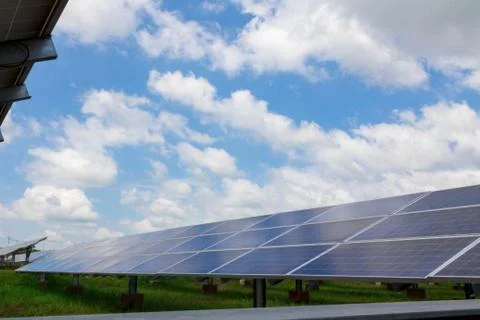 The solar panel tracking system with cloud and blue sky Stock Photos
