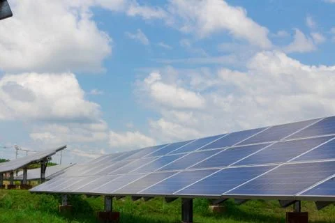 The solar panel tracking system with cloud and blue sky Stock Photos
