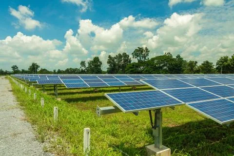 The solar panel tracking system with cloud and blue sky Stock Photos