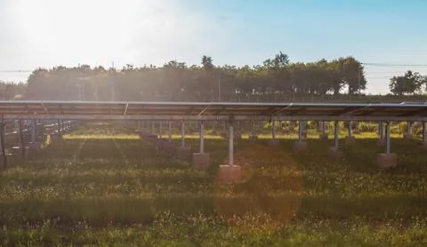 The solar panel tracking system with cloud and blue sky Stock Photos