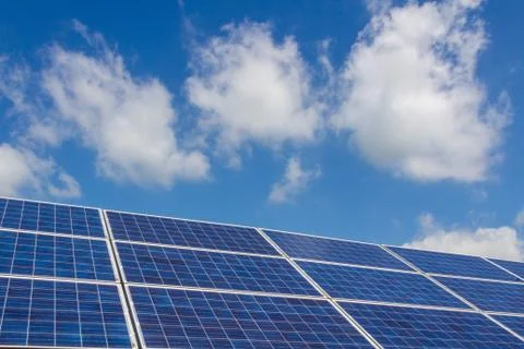 The solar panel tracking system with cloud and blue sky Stock Photos