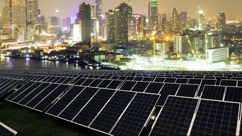 Solar panel with twilight city time lapse 動画素材 102609659