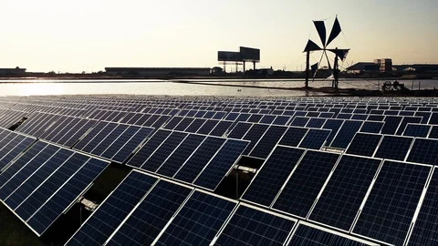 Solar panel with windmill background Stock Footage 90223772