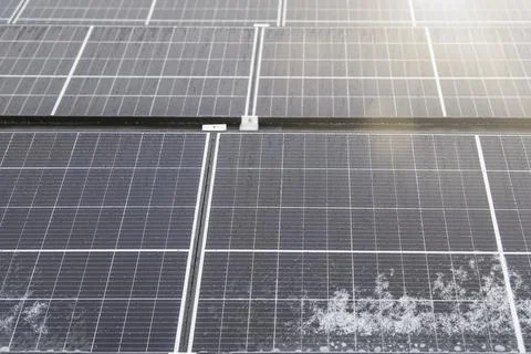 Solar panel in winter. Solar panels are covered with snow on the roof of the Stock Photos