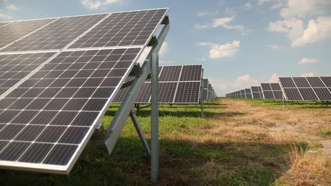 Solar panels against deep blue sky. Solar cells farm. Photovoltaic energy Stock Footage 154015053