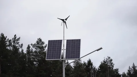 Solar panels and a small wind turbine for the production of environmentally Stock Footage 107000932