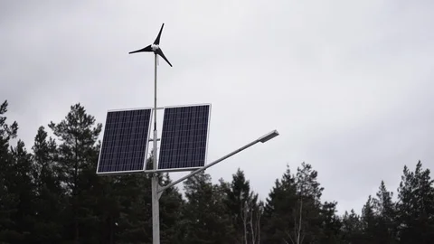 Solar panels and a small wind turbine for the production of environmentally Stock Footage 107080625