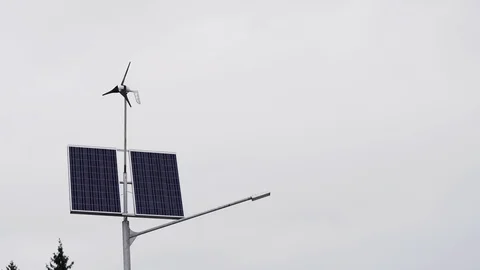 Solar panels and a small wind turbine for the production of environmentally Stock Footage 107081151