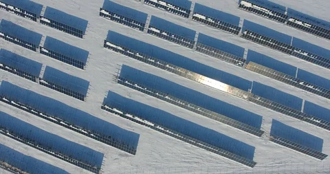 The Solar Panels are covered by snow. A Long shadows from the panels - 15 스톡 동영상 86564079