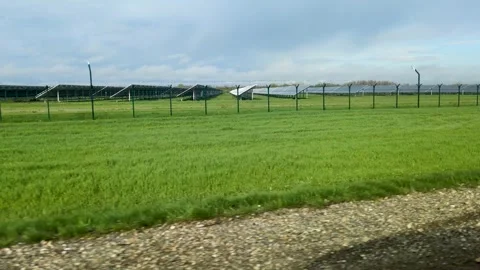 Solar panels are installed behind the fence - an ecological energy concept Stock Footage 305897643