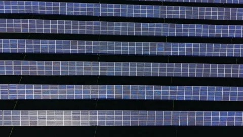 Solar panels arranged in rows on a clear day in an energy field Stock Footage 334028371