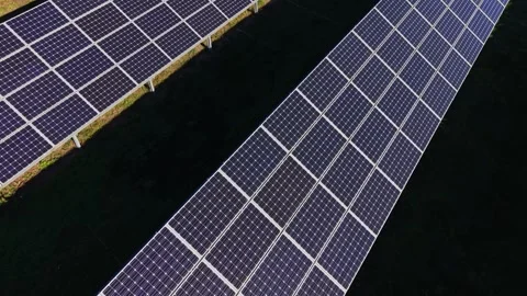 Solar panels arranged in rows at renewable energy site under clear sky Stock Footage 334028402