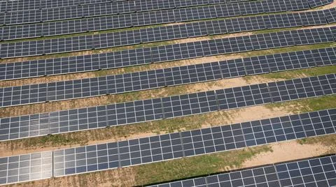 Solar panels array farm with sunlight create clean electric power Stock Photos