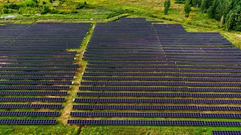 Solar panels array at solar farm clean renewable energy static aerial Stock Footage 330922999