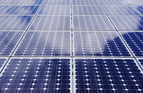 Solar panels with cloud reflections Stock Photos