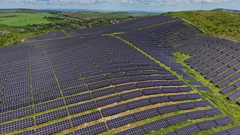 Solar panels cover a hillside in a renewable energy project in daytime Stock Footage 339019688