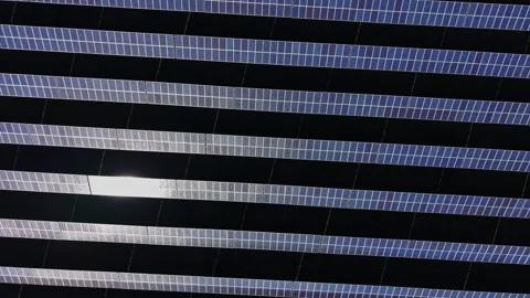 Solar panels cover a large area under the sun with clear blue sky 動画素材 334030010