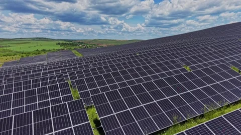 Solar panels cover a large area in a field on a sunny day Stock-Footage 339019842