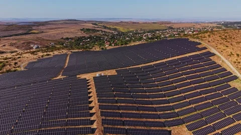 Solar panels cover a large area in a rural landscape Stock Footage 344540493