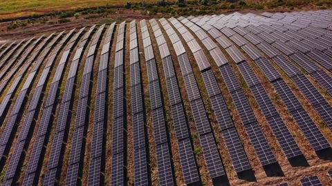 Solar panels cover a large area in a renewable energy farm Stock Footage 344540942