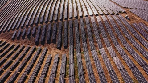 Solar panels cover large field during sunny day Stock Footage 344540927