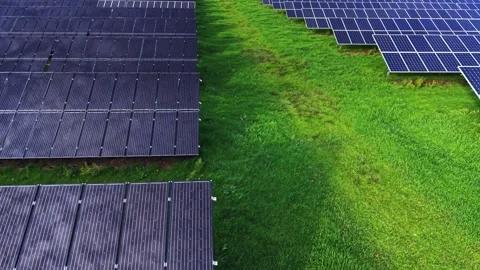 Solar panels cover vast fields, showcasing renewable energy potential Stock Footage 325088531