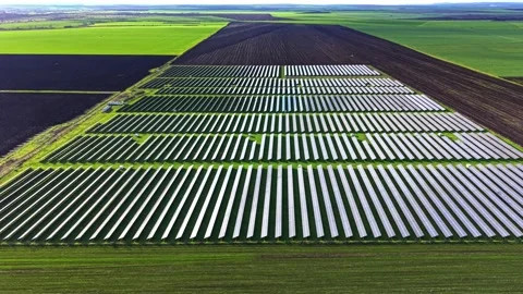 Solar panels cover vast fields promoting renewable energy production Stock Footage 325088804