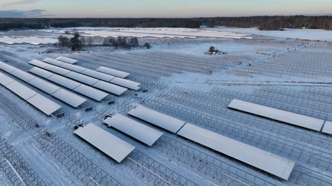 Solar panels covered in snow during winter in northern europe Stock Footage 297054033