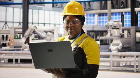 Solar panels factory engineer analyzing data from IoT sensors Stock Photos